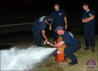 Fire company conducting flow test on hydrant in district
