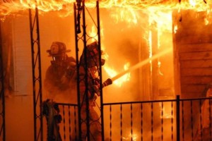Have you ever heard the expression, "Like rearranging the deck chairs on the Titanic," to describe a situation where the response to the conditions is inappropriate?  What was being gained by having these two firefighters "up close and personal" with a fire of this magnitude?  And with a hose line that's capable of 200 gpm for fire flow at best?